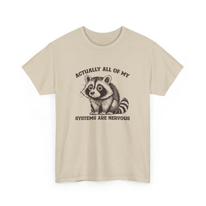 Front view of a beige T-shirt with "Actually All Of My Systems Are Nervous" text and a raccoon graphic. Part of the Vivid Divergence Sensory Friendly Unisex Tees Range.
