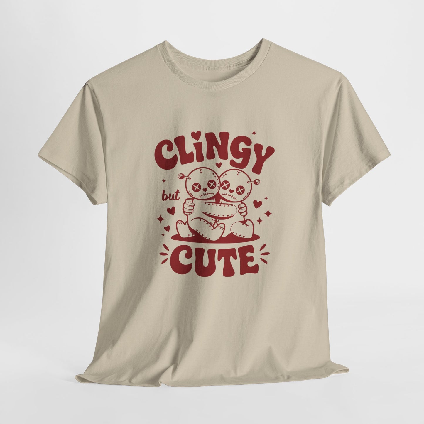 Hanging beige T-shirt with red text and cartoon sloth illustration that reads "Clingy But Cute." Exclusive release for Valentine’s Day. Part of the Vivid Divergence Sensory Friendly Unisex Tees Range.