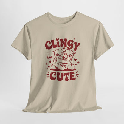 Hanging beige T-shirt with red text and cartoon sloth illustration that reads "Clingy But Cute." Exclusive release for Valentine’s Day. Part of the Vivid Divergence Sensory Friendly Unisex Tees Range.