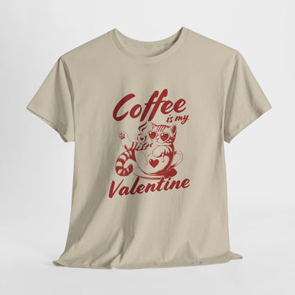 Hanging beige T-shirt with red text and cat illustration holding a coffee cup that reads "Coffee Is My Valentine." Exclusive release for Valentine’s Day. Part of the Vivid Divergence Sensory Friendly Unisex Tees Range.