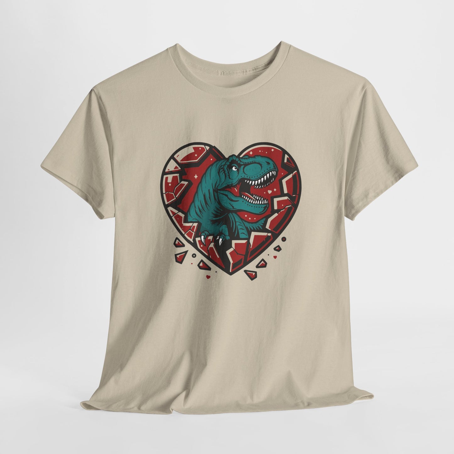 Hanging beige T-shirt featuring a green dinosaur inside a cracked red heart with small black hearts around it. Exclusive release for Valentine’s Day. Part of the Vivid Divergence Sensory Friendly Unisex Tees Range.