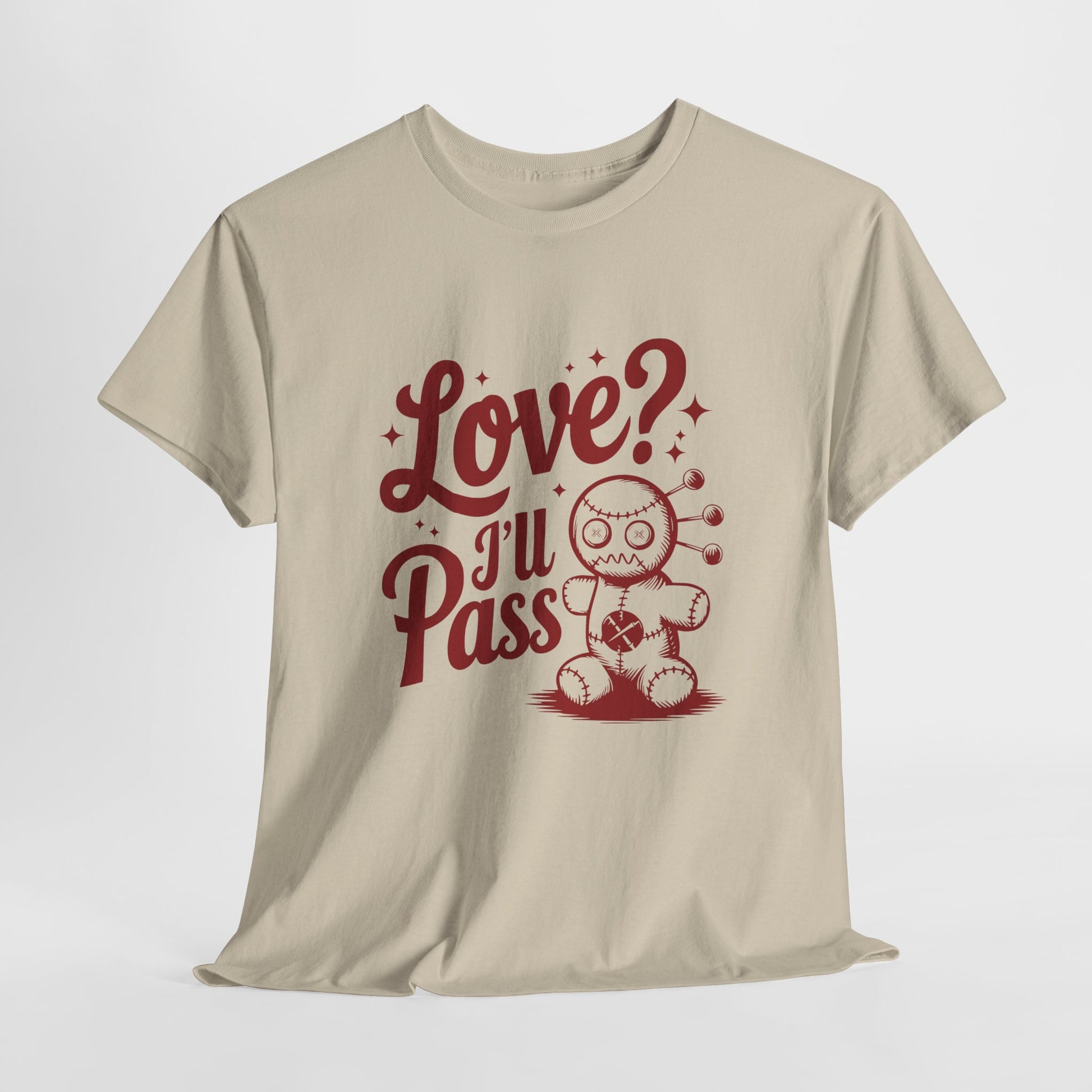 Hanging beige T-shirt with red text and a cartoon coffee cup illustration that reads "Love? I’ll Pass." Exclusive release for Valentine’s Day. Part of the Vivid Divergence Sensory Friendly Unisex Tees Range.