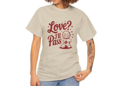 Woman with curly hair wearing a beige T-shirt with red text and a cartoon coffee cup illustration that reads "Love? I’ll Pass." Exclusive release for Valentine’s Day. Part of the Vivid Divergence Sensory Friendly Unisex Tees Range.