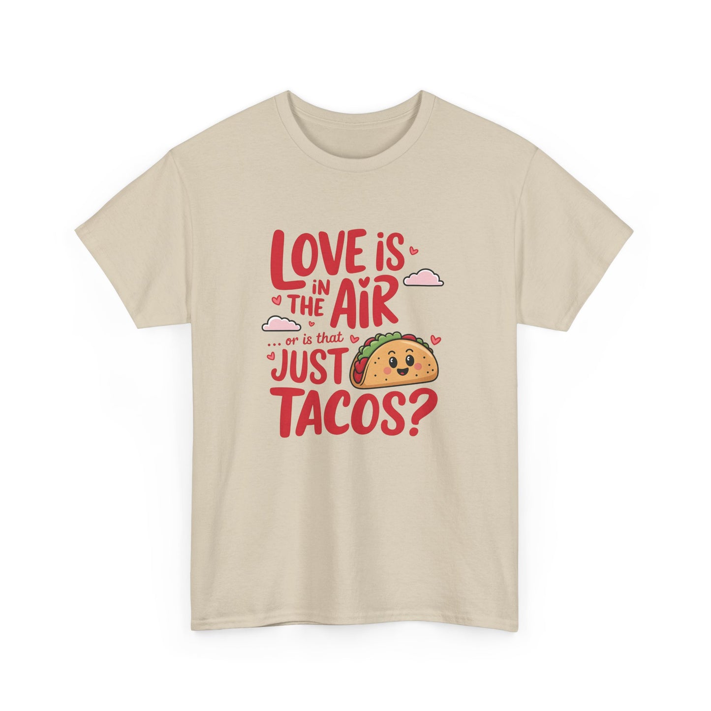 Front view of a beige T-shirt featuring red and black text with a taco illustration that reads "Love Is In The Air Or Is It Just Tacos?" Exclusive release for Valentine’s Day. Part of the Vivid Divergence Sensory Friendly Unisex Tees Range.