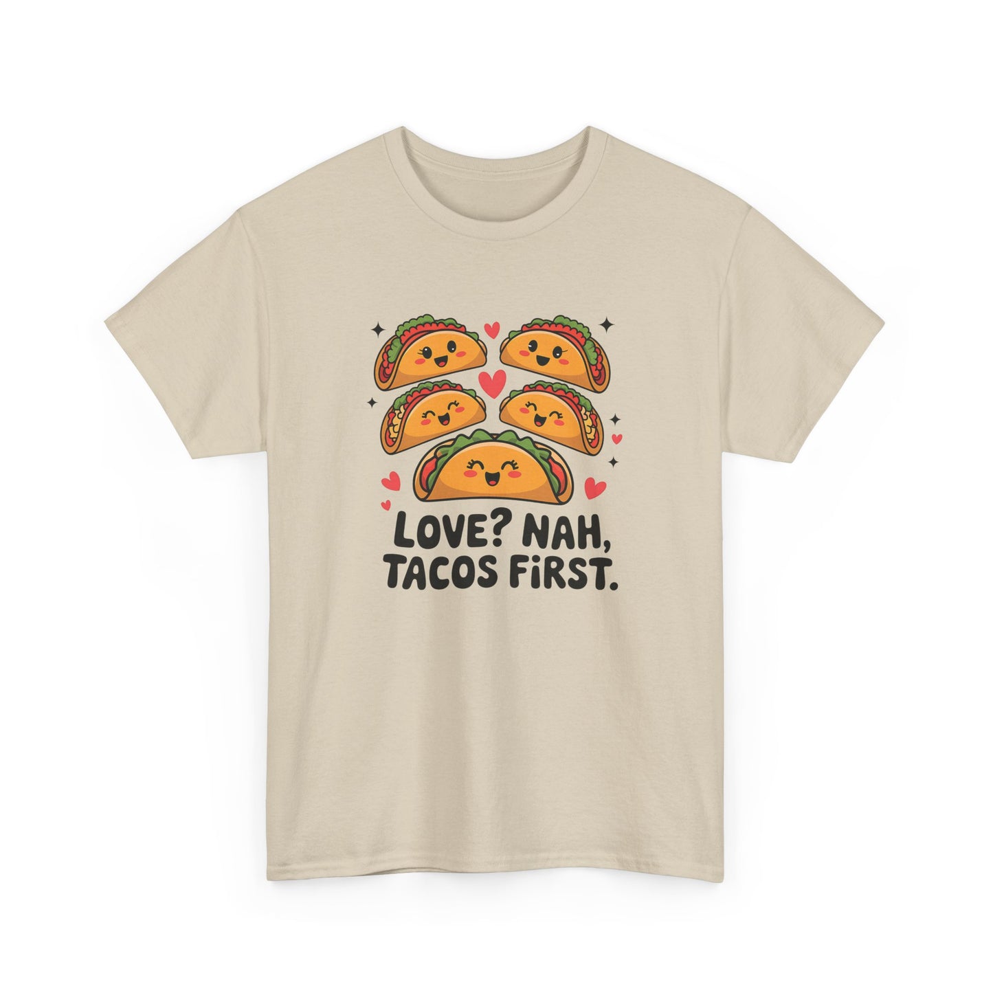 Front view of a beige T-shirt featuring an illustration of tacos and black text that reads "Love? Nah, Tacos First." Exclusive release for Valentine’s Day. Part of the Vivid Divergence Sensory Friendly Unisex Tees Range.