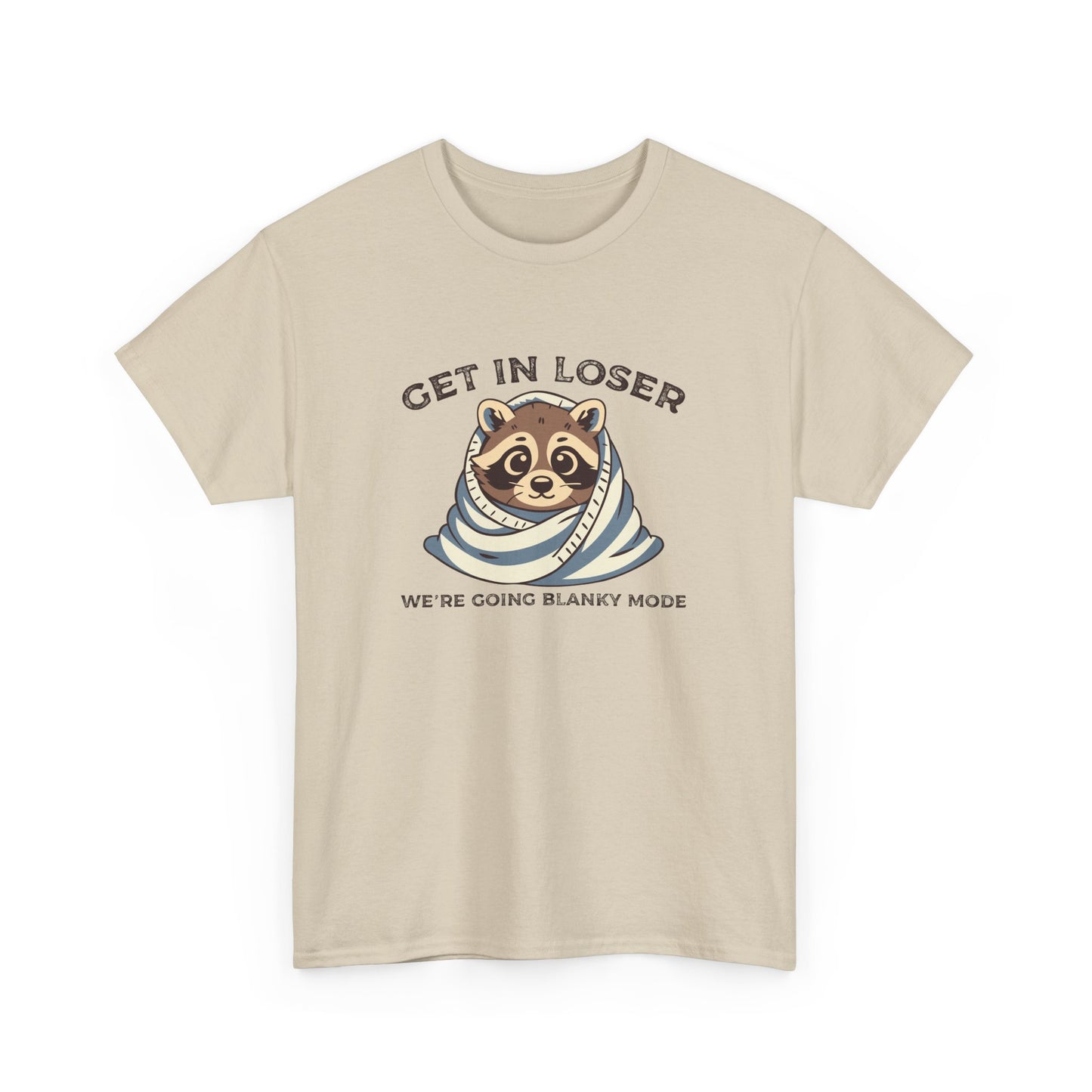 Hanging front view of a beige T-shirt featuring a cute raccoon wrapped in a blanket with text that reads "Get In Loser, We're Going Blanky Mode." Part of the Vivid Divergence Sensory Friendly Unisex Tees Range.