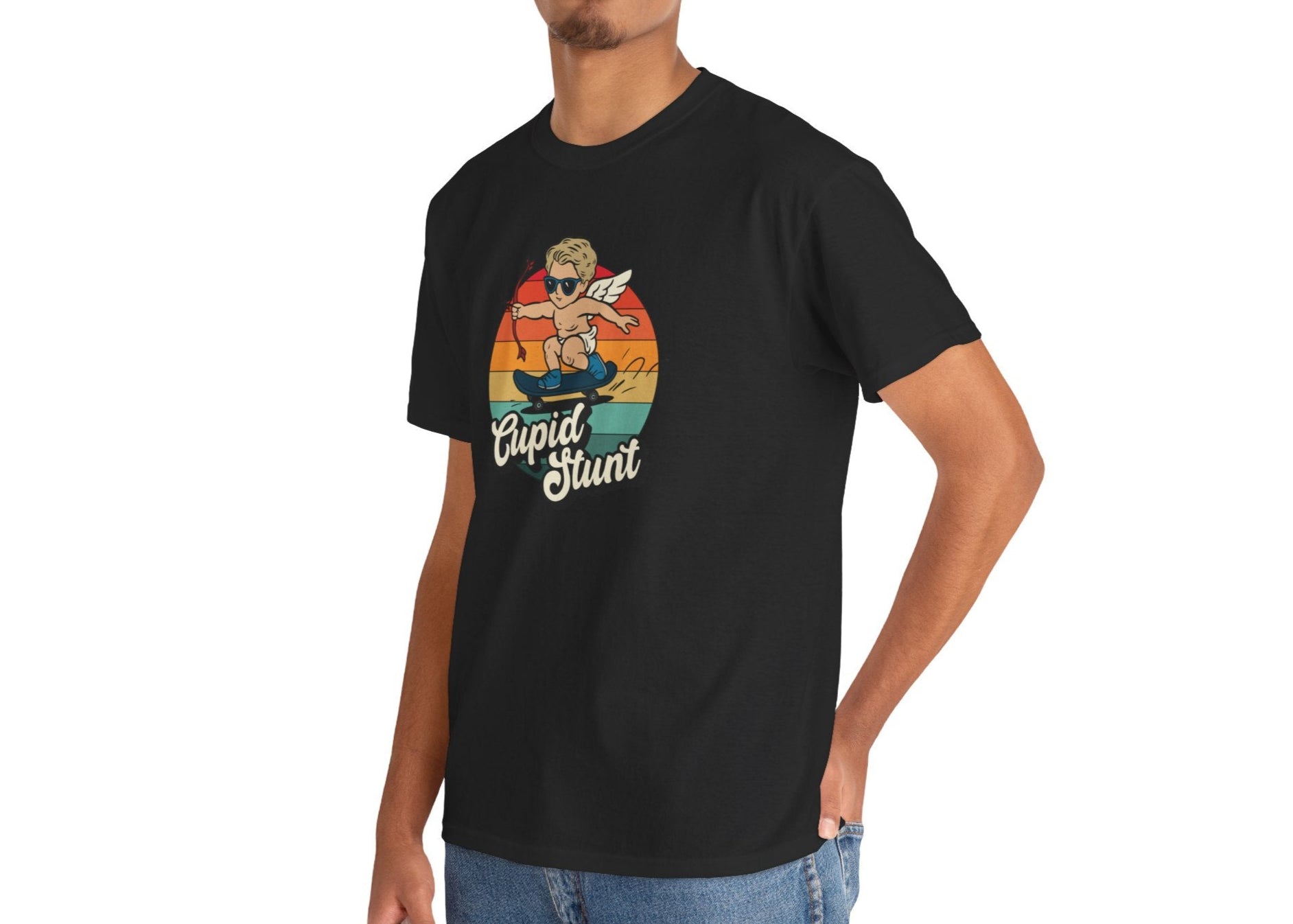 Man wearing a black T-shirt featuring a retro sunset background and a cartoon cupid with the text "Cupid Stunt." Exclusive release for Valentine’s Day. Part of the Vivid Divergence Sensory Friendly Unisex Tees Range.