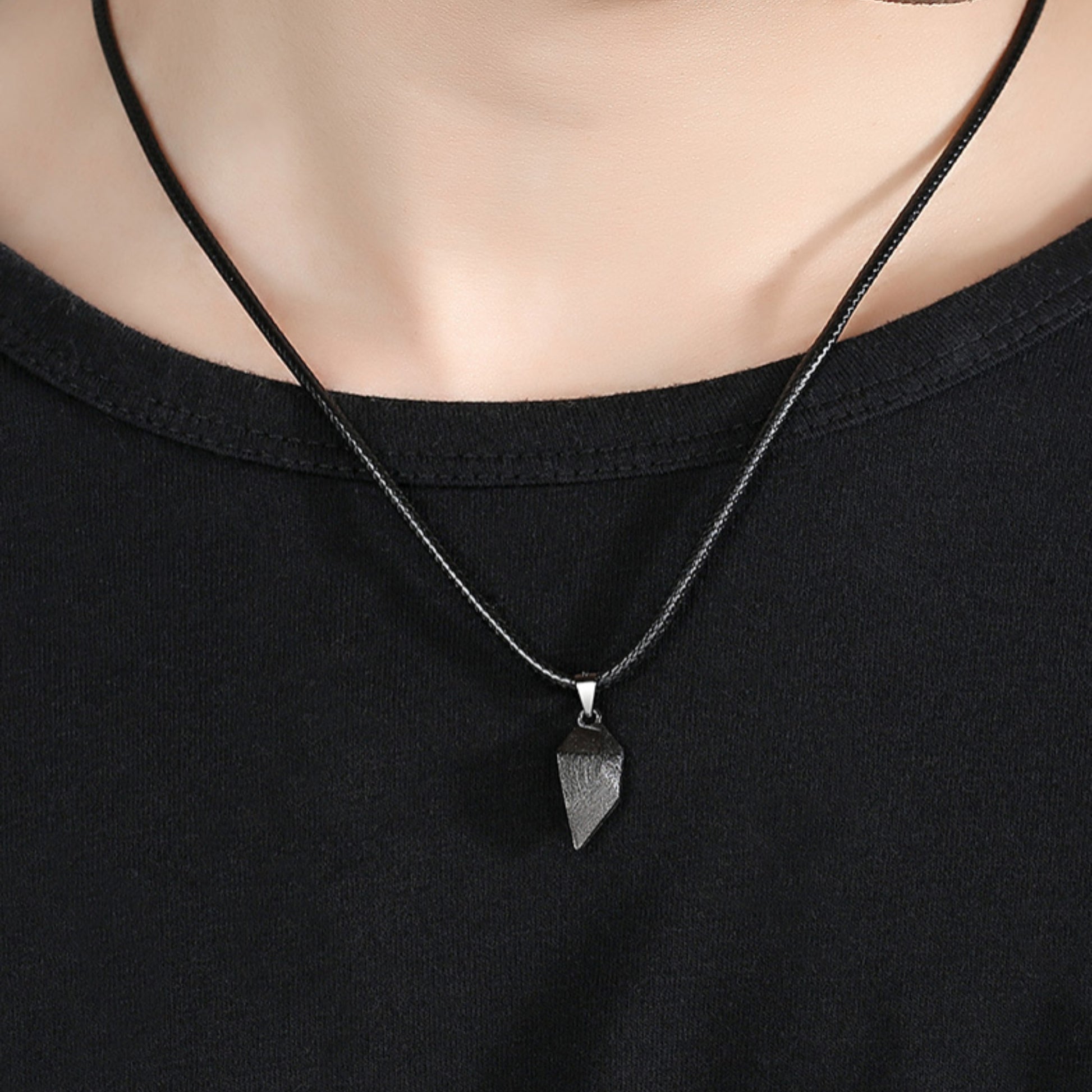 Black geometric pendant necklace worn on a black cord, perfect as cool friendship necklaces or mother-daughter jewelry.