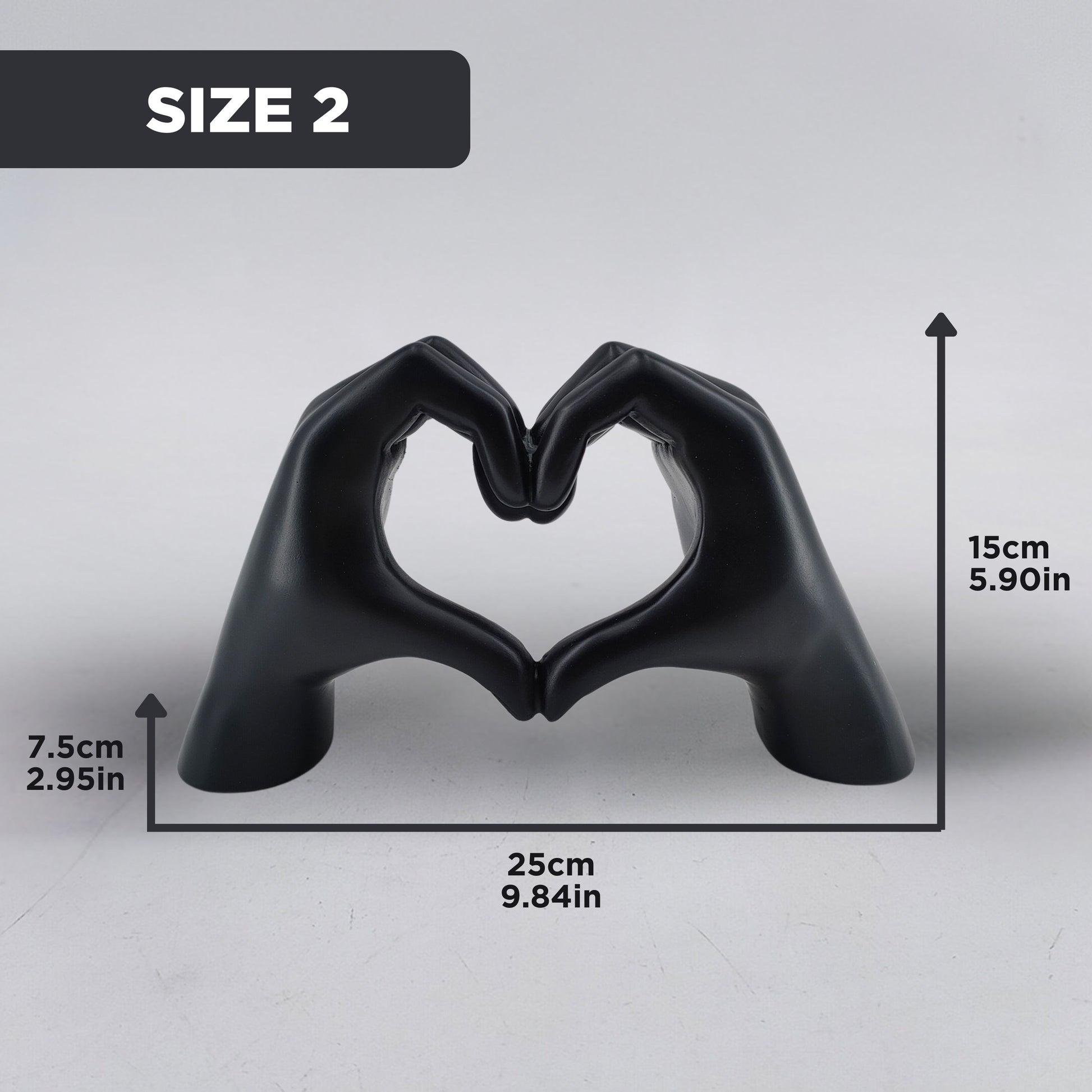 Black hand-shaped sculpture forming a heart with dimensions of 15 cm height, 25 cm width, and 7.5 cm depth for Size 2 selection. Elegant dopamine decor and an ideal gift for Valentine's Day.