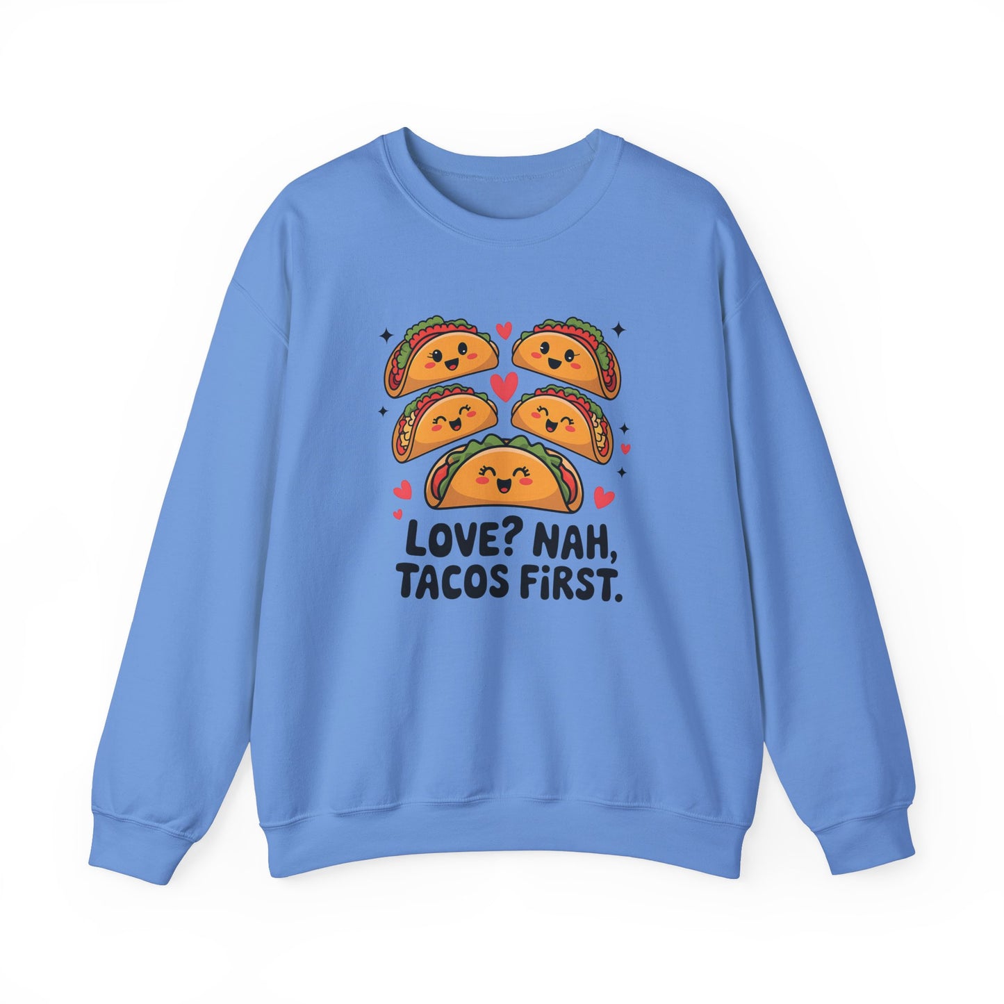 Front view of a blue sweatshirt with "Love? Nah. Tacos First." text and cute taco characters design in orange and brown. Exclusive release for Valentine's Day. Part of the Vivid Divergence Sensory Friendly Sweaters Range.