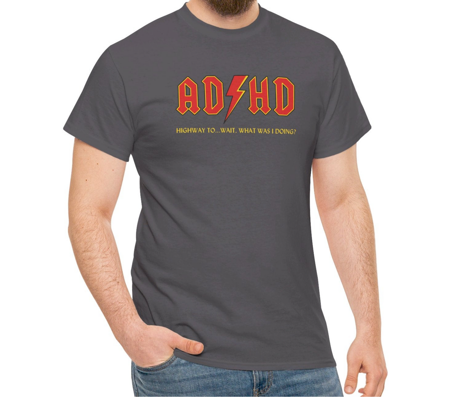 Model wearing a charcoal gray T-shirt with orange "AD/HD" text, inspired by AC/DC, styled casually with jeans. Part of the Vivid Divergence Sensory Friendly Unisex Tees Range.