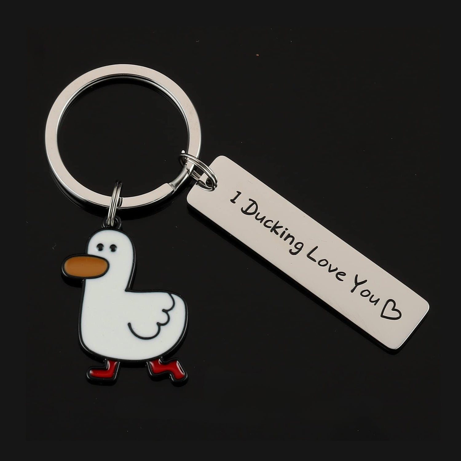 Duck-themed keychain with red-booted duck charm and silver engraved tag reading "I Ducking Love You ♥" on a black background.