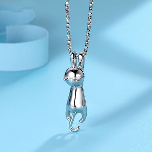 Close-up of the Hang Tight Cat Necklace in silver titanium steel, featuring an adorable design of a cat hanging from the chain, displayed on a light blue background.