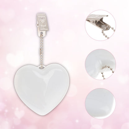 Heart-shaped LED bag clip with detailed close-ups of the clasp and chain, showcasing its stylish and durable design.