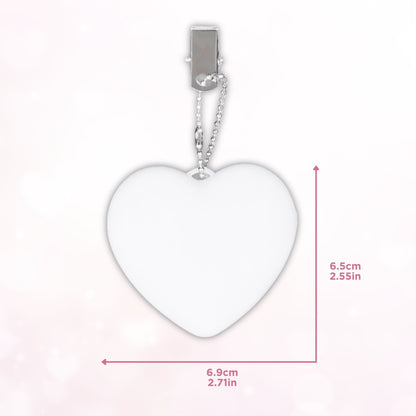 Heart-shaped LED bag clip with measurements displayed, emphasizing its compact and portable dimensions.