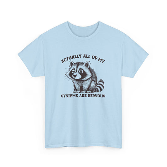 Front view of a light blue T-shirt with "Actually All Of My Systems Are Nervous" text and a raccoon graphic. Part of the Vivid Divergence Sensory Friendly Unisex Tees Range.
