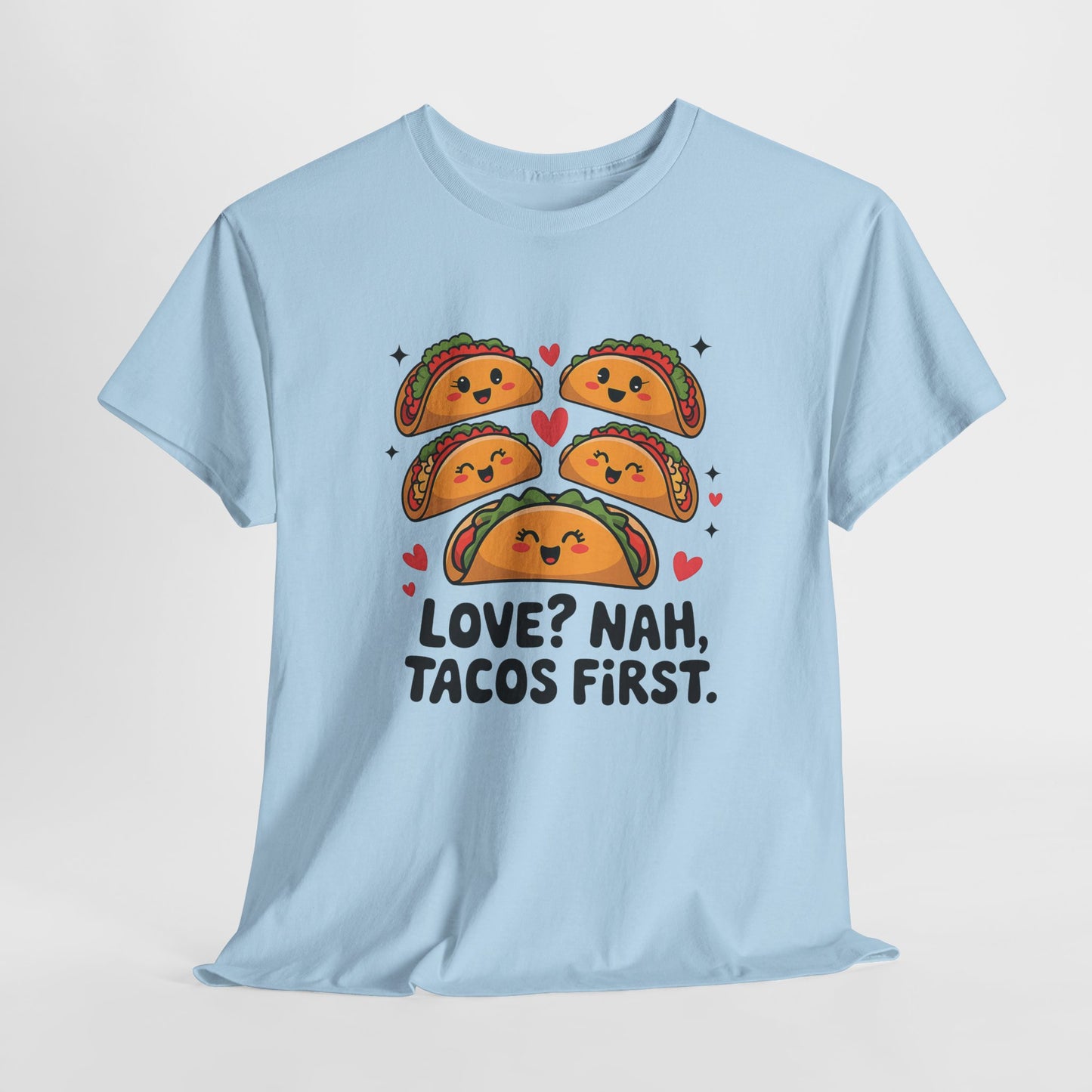 Hanging light blue T-shirt featuring an illustration of tacos and black text that reads "Love? Nah, Tacos First." Exclusive release for Valentine’s Day. Part of the Vivid Divergence Sensory Friendly Unisex Tees Range.