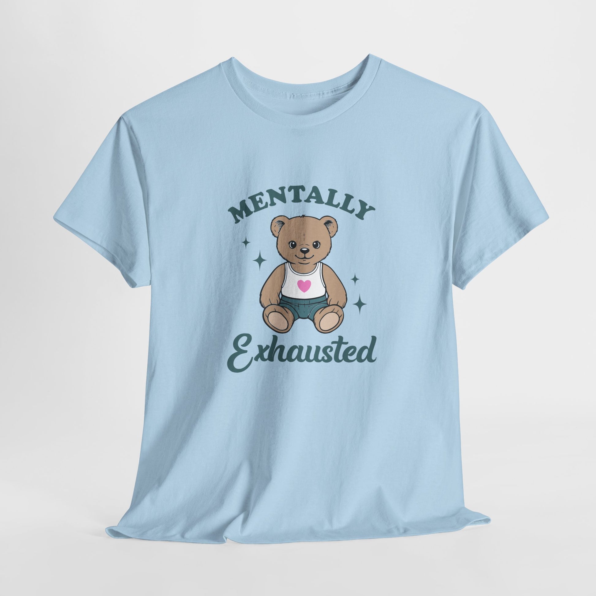 Front view of a light blue T-shirt featuring a teddy bear graphic with the text "Mentally Exhausted." Part of the Vivid Divergence Sensory Friendly Unisex Tees Range.