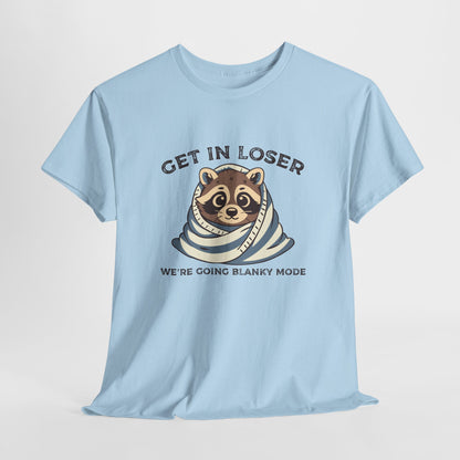 Hanging front view of a light blue T-shirt featuring a cute raccoon wrapped in a blanket with text that reads "Get In Loser, We're Going Blanky Mode." Part of the Vivid Divergence Sensory Friendly Unisex Tees Range.