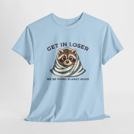 Hanging front view of a light blue T-shirt featuring a cute raccoon wrapped in a blanket with text that reads "Get In Loser, We're Going Blanky Mode." Part of the Vivid Divergence Sensory Friendly Unisex Tees Range.