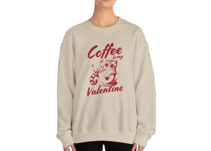 Model wearing a beige sweatshirt with "Coffee is My Valentine" text and coffee cup design in red. Exclusive release for Valentine's Day. Part of the Vivid Divergence Sensory Friendly Sweaters Range.