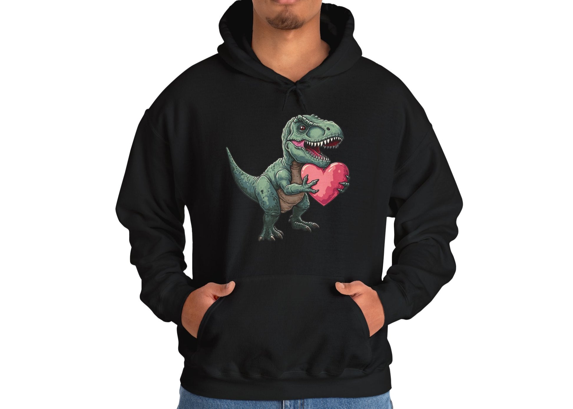 Model wearing a black hoodie featuring a cute cartoon T-Rex holding a pink heart. Exclusive release for Valentine's Day. Part of the Vivid Divergence Sensory Friendly Sweaters Range.