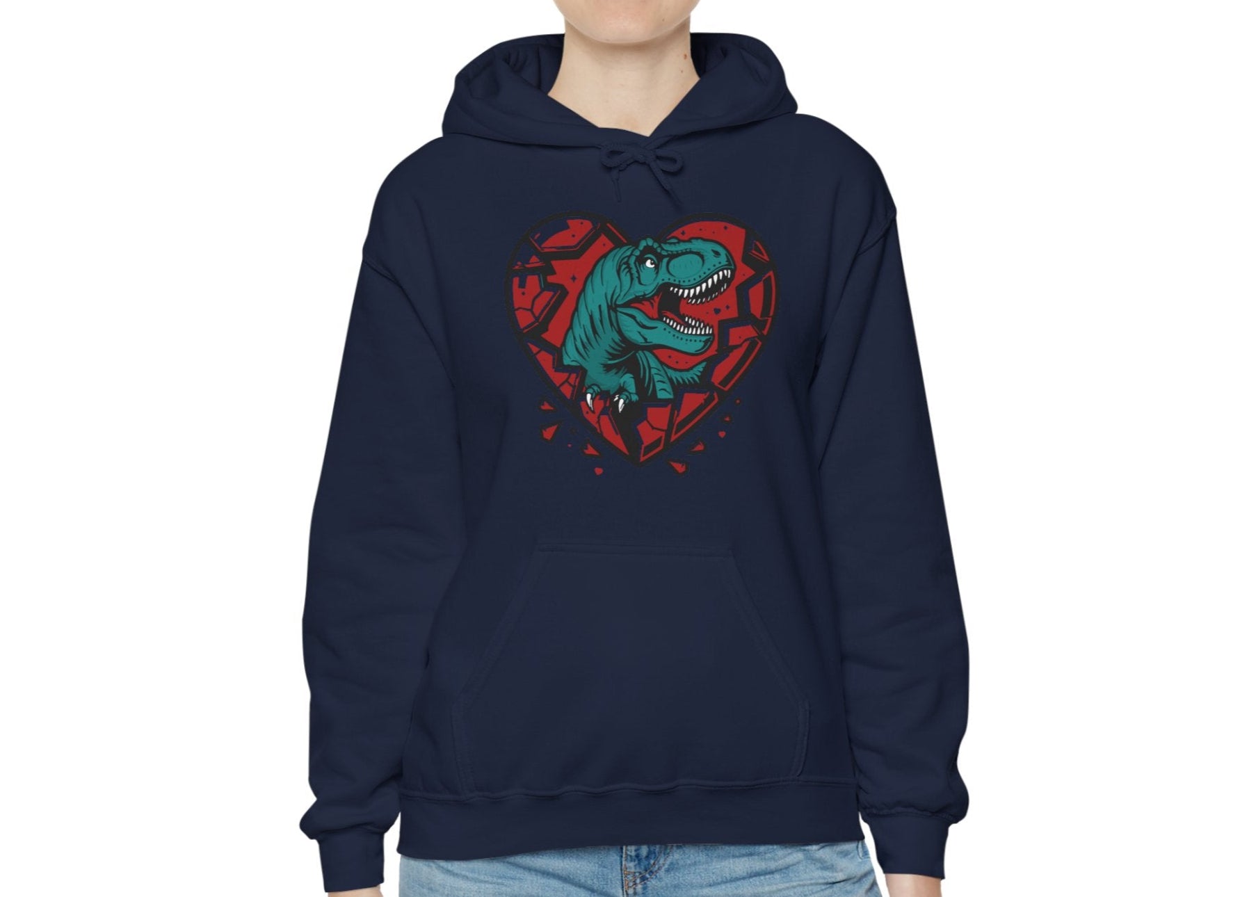 Model wearing a navy hoodie with a shattered heart design featuring a T-Rex emerging from the center in vibrant teal and red tones. Exclusive release for Valentine's Day. Part of the Vivid Divergence Sensory Friendly Sweaters Range.