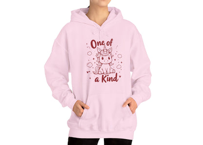 Model wearing a pink hoodie featuring "One of a Kind" text and a cute unicorn design in red. Exclusive release for Valentine's Day. Part of the Vivid Divergence Sensory Friendly Sweaters Range.