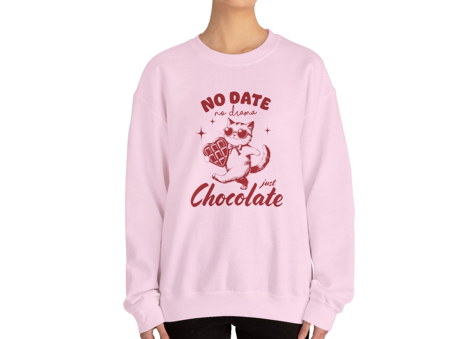 Model wearing a pink sweatshirt with "No Date, Just Chocolate" text and cute cartoon chocolate design in red. Exclusive release for Valentine's Day. Part of the Vivid Divergence Sensory Friendly Sweaters Range.