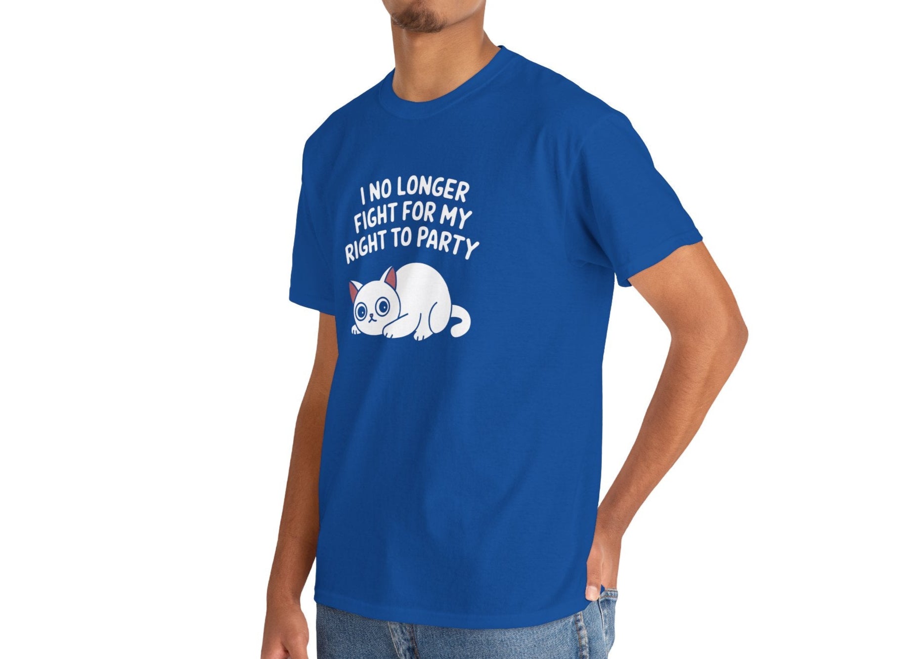 Model wearing a royal blue T-shirt with the text "I No Longer Fight For My Right To Party" above a napping white cat graphic, standing confidently. Part of the Vivid Divergence Sensory Friendly Unisex Tees Range.