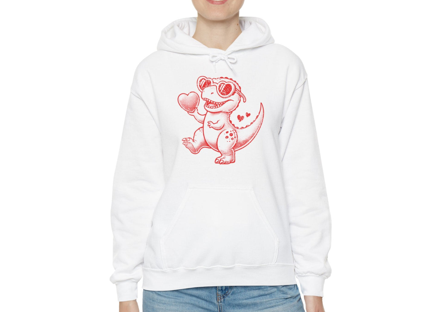 Model wearing a white hoodie featuring a cute cartoon dinosaur holding hearts in a red design. Exclusive release for Valentine's Day. Part of the Vivid Divergence Sensory Friendly Sweaters Range.