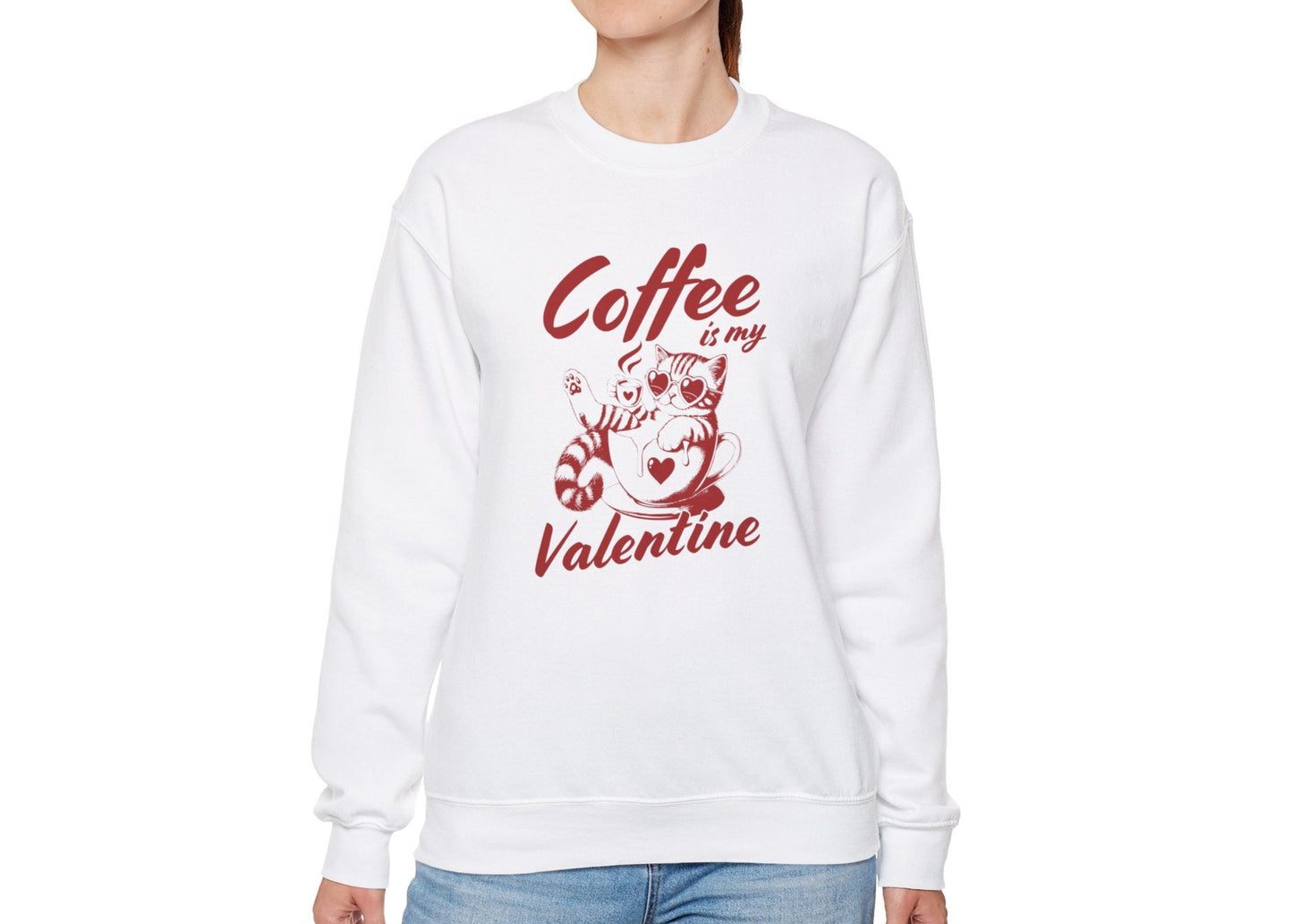 Model wearing a white sweatshirt with "Coffee is My Valentine" text and coffee cup design in red. Exclusive release for Valentine's Day. Part of the Vivid Divergence Sensory Friendly Sweaters Range.