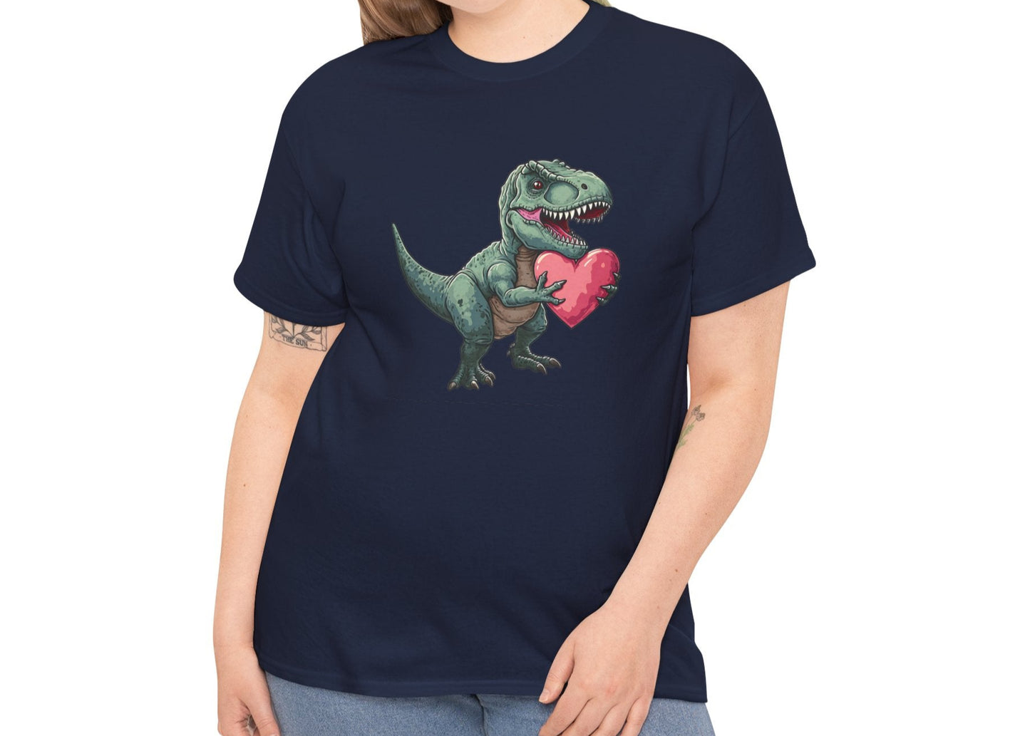 Modeled view of a navy T-shirt featuring a playful T-Rex holding a pink heart. Part of the Vivid Divergence Sensory Friendly Unisex Tees Range.