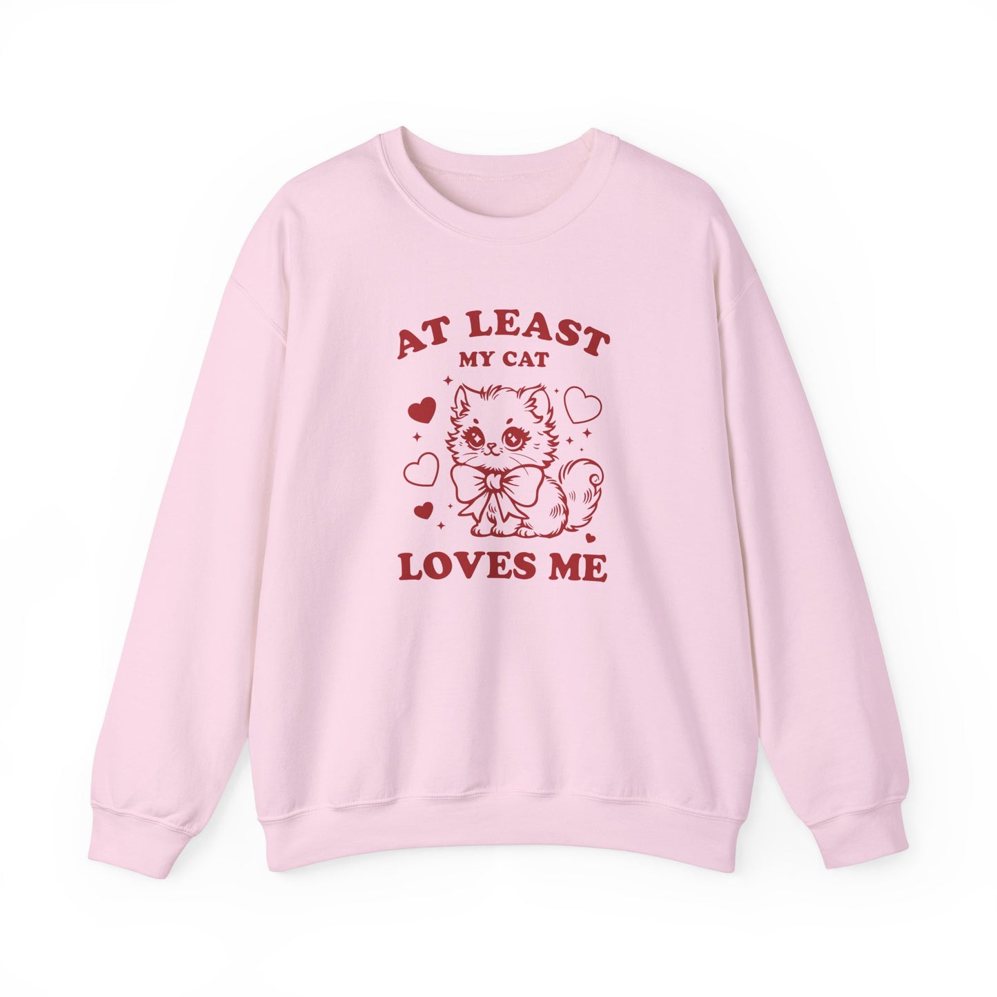 Front view of a pink sweatshirt with "At Least My Cat Loves Me" text and cartoon cat design in red. Part of the Vivid Divergence Sensory Friendly Sweaters Range.