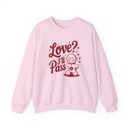 Front view of a pink sweatshirt with "Love? I'll Pass" text and a cute voodoo doll design in red. Exclusive release for Valentine's Day. Part of the Vivid Divergence Sensory Friendly Sweaters Range.