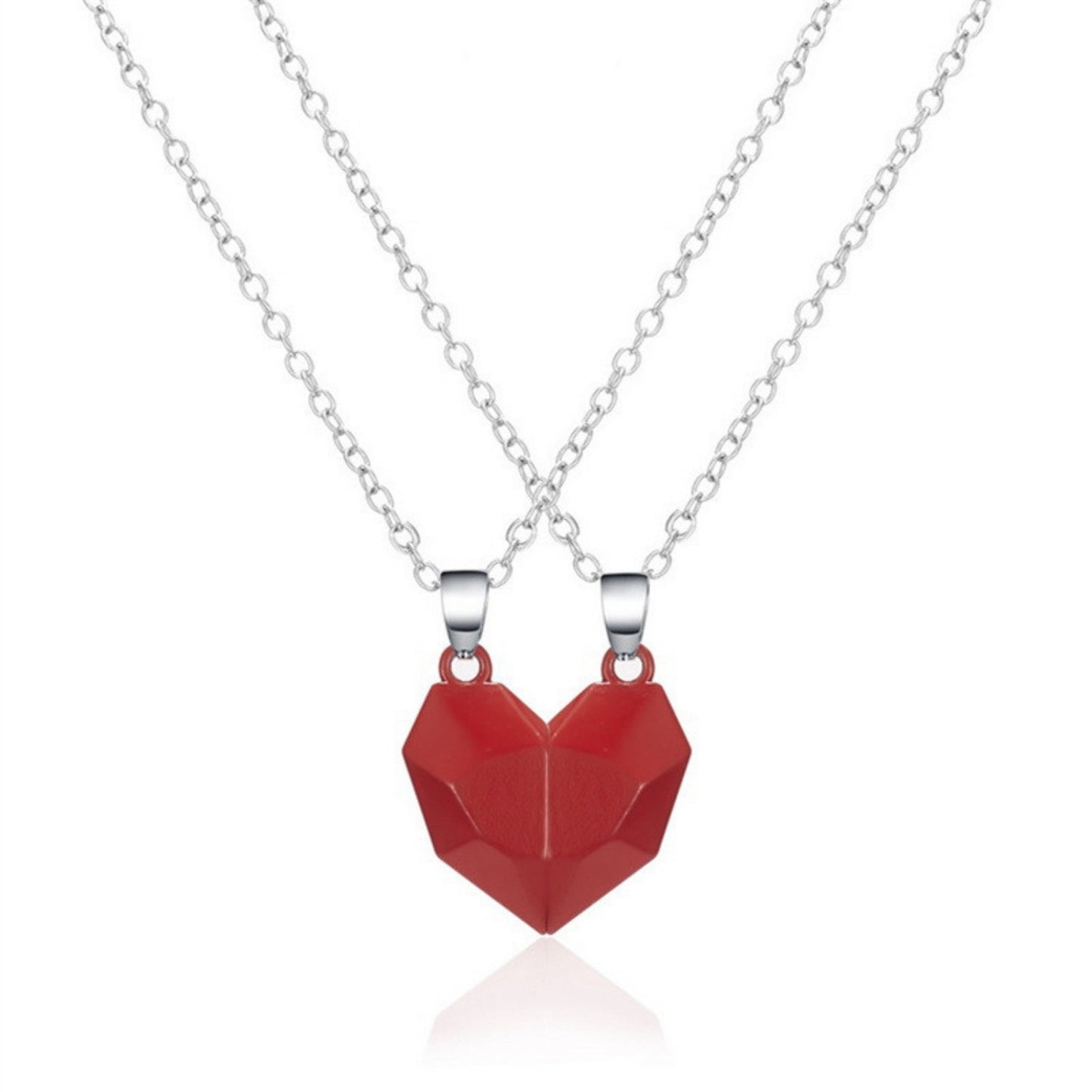 Matching red heart-shaped necklaces on silver chains, perfect for couples or mother-daughter jewelry.