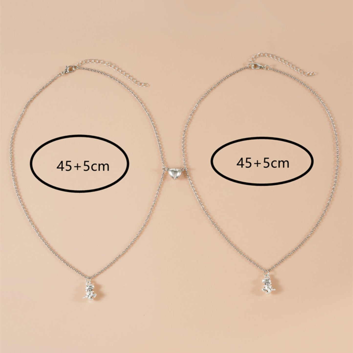 Silver matching necklaces with 45+5cm adjustable chains, featuring magnetic heart and dinosaur pendants. Ideal best BFF necklaces.