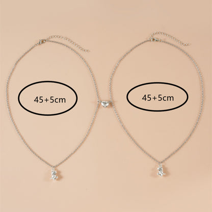 Silver matching necklaces with 45+5cm adjustable chains, featuring magnetic heart and dinosaur pendants. Ideal best BFF necklaces.