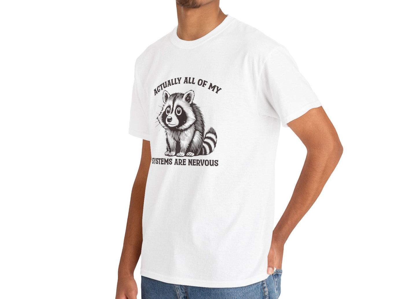 Model wearing a white T-shirt with "Actually All Of My Systems Are Nervous" text and a raccoon graphic. Part of the Vivid Divergence Sensory Friendly Unisex Tees Range.
