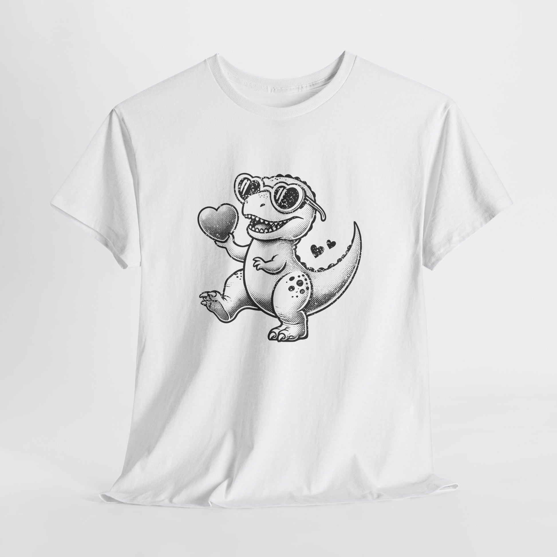 Front view of a white T-shirt featuring a black-and-white cartoon dinosaur holding a heart, designed for Valentine’s Day. Exclusive release for Valentine’s Day. Part of the Vivid Divergence Sensory Friendly Unisex Tees Range.