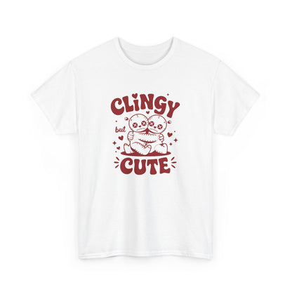 Front view of a white T-shirt with red text and cartoon sloth illustration that reads "Clingy But Cute." Exclusive release for Valentine’s Day. Part of the Vivid Divergence Sensory Friendly Unisex Tees Range.