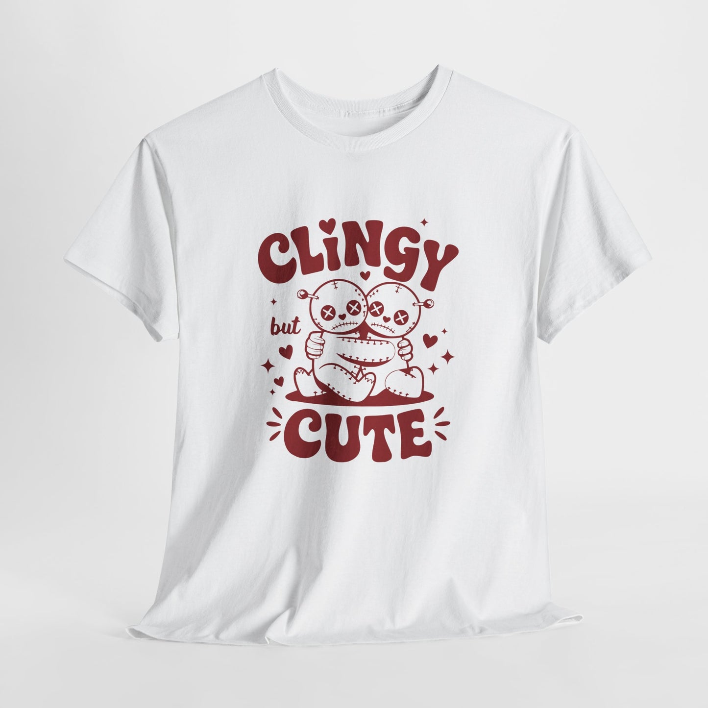 Hanging white T-shirt with red text and cartoon sloth illustration that reads "Clingy But Cute." Exclusive release for Valentine’s Day. Part of the Vivid Divergence Sensory Friendly Unisex Tees Range.