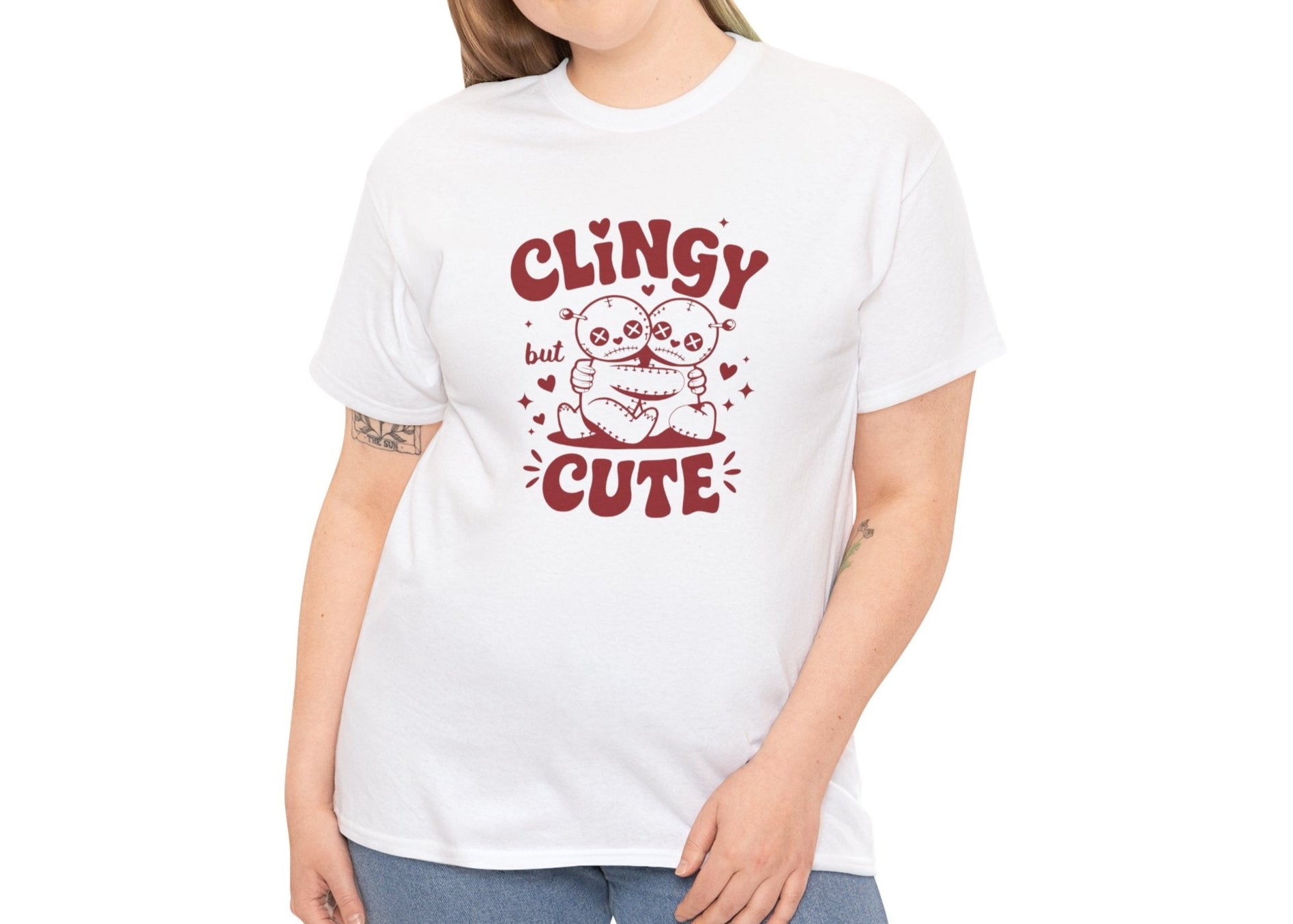 Woman wearing a white T-shirt with red text and cartoon sloth illustration that reads "Clingy But Cute." Exclusive release for Valentine’s Day. Part of the Vivid Divergence Sensory Friendly Unisex Tees Range.