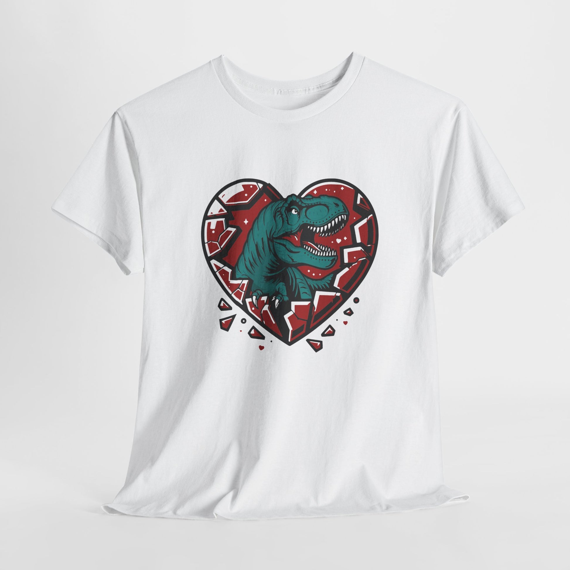 Hanging white T-shirt featuring a green dinosaur inside a cracked red heart with small black hearts around it. Exclusive release for Valentine’s Day. Part of the Vivid Divergence Sensory Friendly Unisex Tees Range.