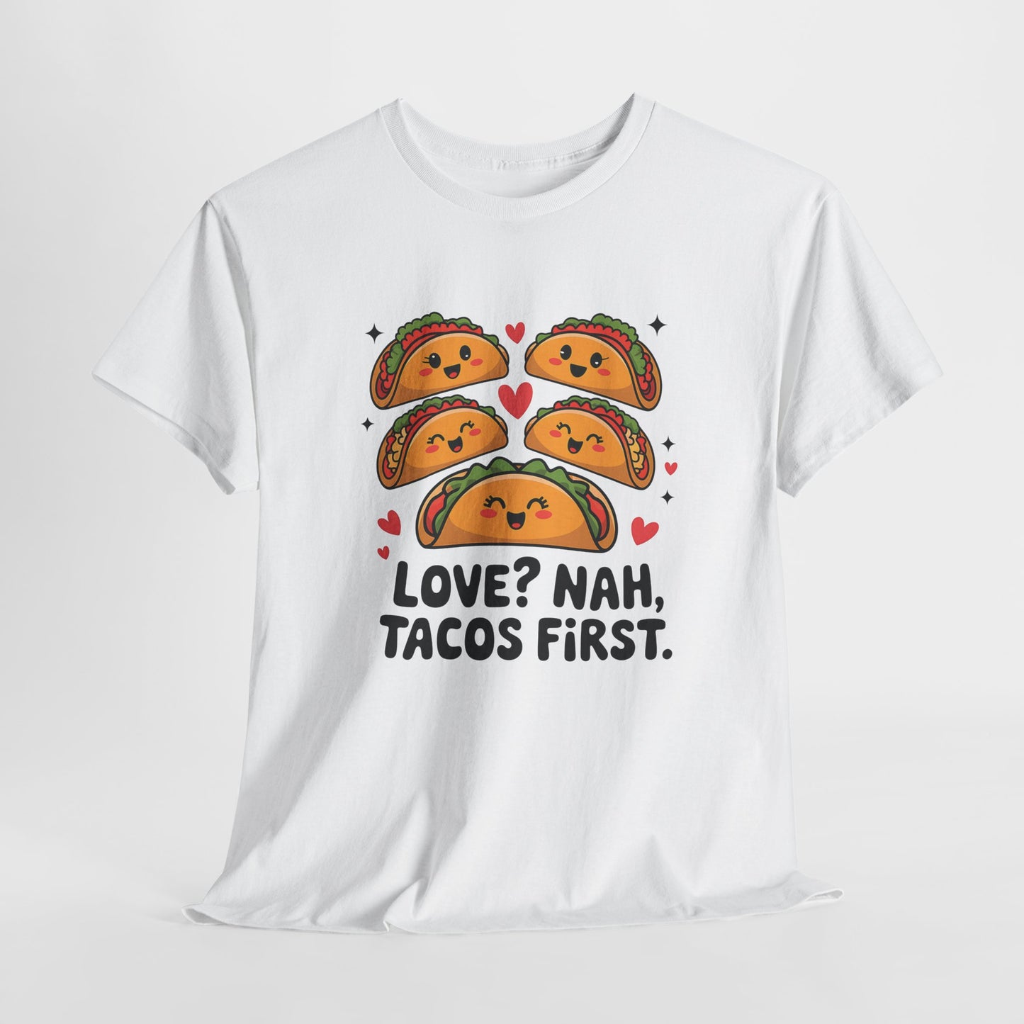 Hanging white T-shirt featuring an illustration of tacos and black text that reads "Love? Nah, Tacos First." Exclusive release for Valentine’s Day. Part of the Vivid Divergence Sensory Friendly Unisex Tees Range.