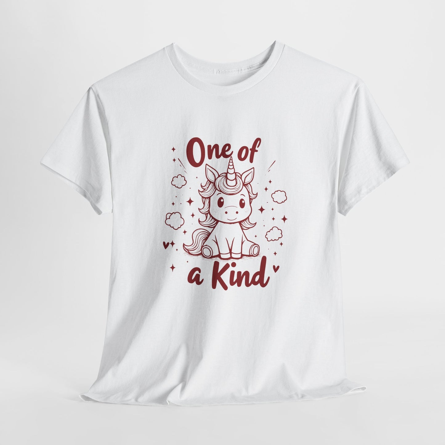 Hanging view of a white T-shirt with "One of a Kind" text and a cute doodle-style unicorn surrounded by hearts and sparkles. Part of the Vivid Divergence Sensory Friendly Unisex Tees Range.