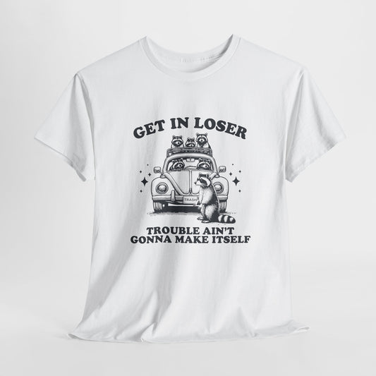 Hanging front view of a white T-shirt featuring black text and an illustration of cute raccoons in a vintage car that reads "Get In Loser, Trouble Ain't Gonna Make Itself." Part of the Vivid Divergence Sensory Friendly Unisex Tees Range.