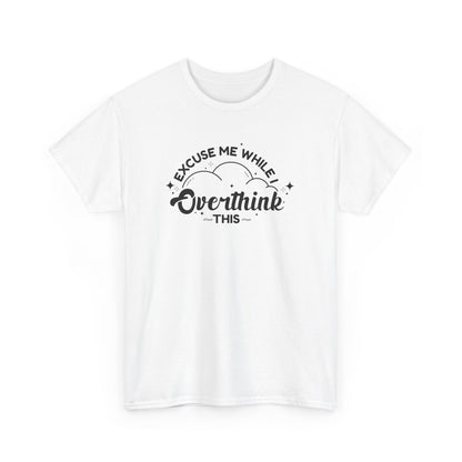 Flat-lay of a white T-shirt featuring the text "Excuse Me While I Overthink This." Part of the Vivid Divergence Sensory Friendly Unisex Tees Range.