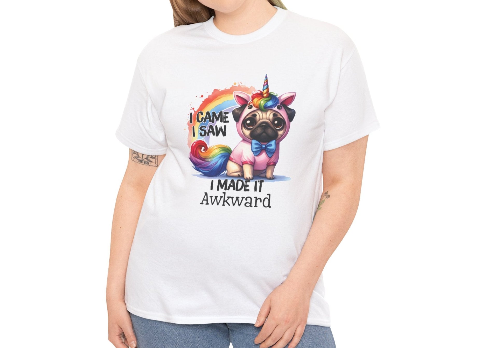 Woman wearing a white T-shirt featuring a colorful unicorn pug design with the text "I Came, I Saw, I Made It Awkward." Part of the Vivid Divergence Sensory Friendly Unisex Tees Range.